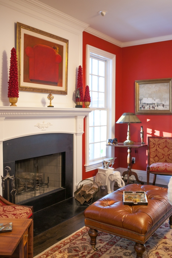 Bright red walls enliven the space, especially because it is flanked by the white Potting Porch and a white Game Room, beyond.