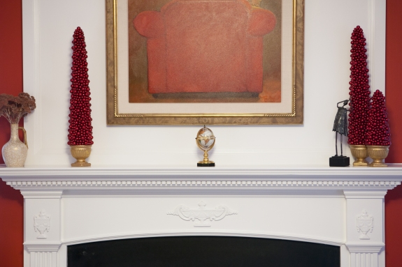 Mantel and paint inspired by red painting over fireplace.